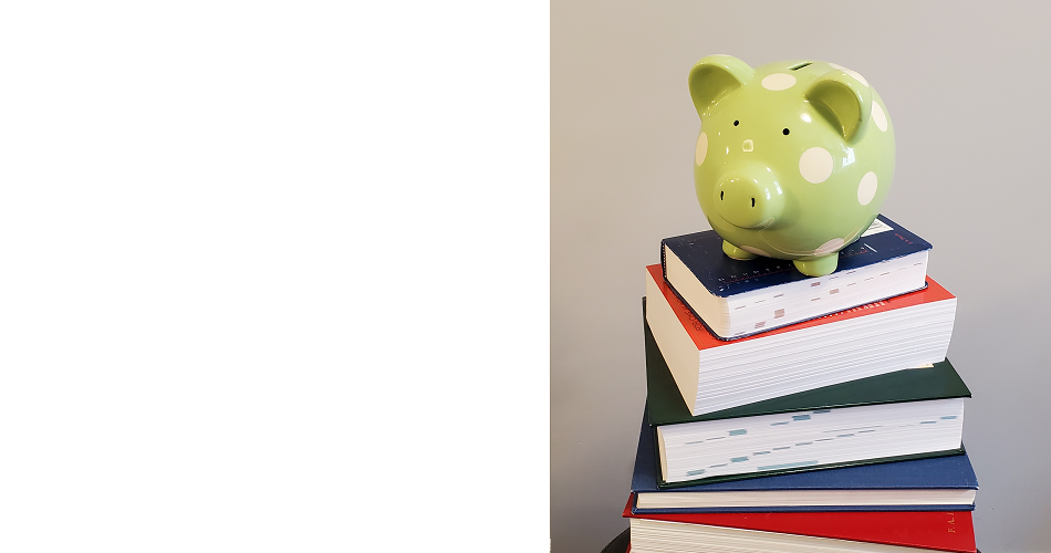 piggy bank on top of books
